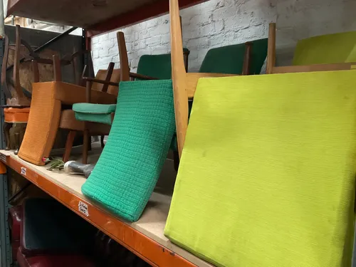 retro green fabric chairs with dark wood legs