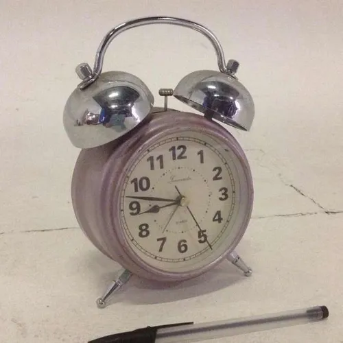 Timemaster pink twin bell analogue wind up alarm clock with cream face and glass face cover