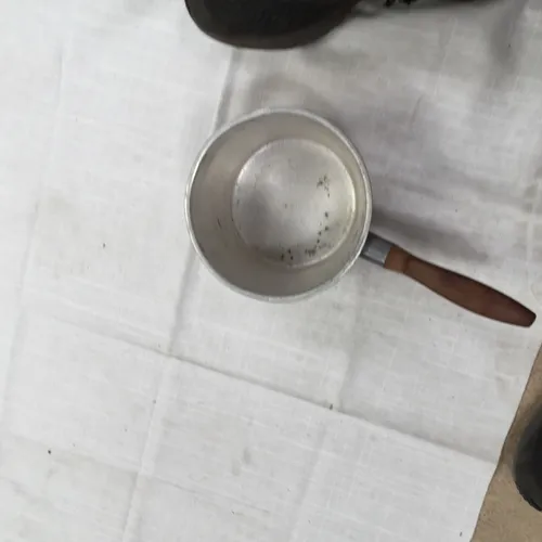 Small metal pan with wooden handle 