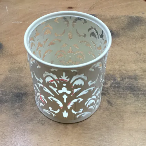 White ornate cut out pen pot