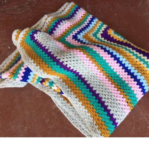 multi coloured knitted / crocheted blanket