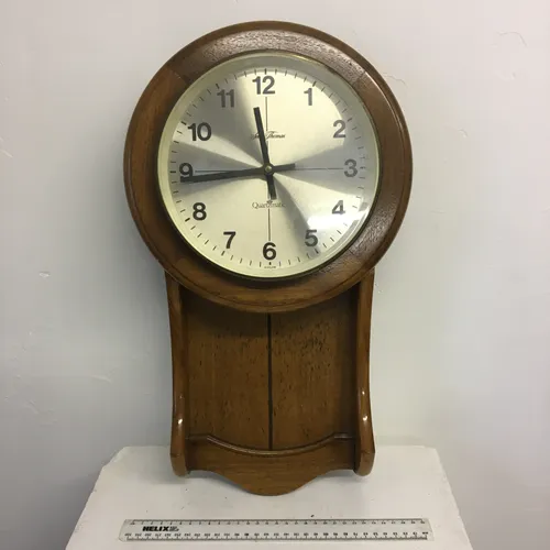 Seth Thomas wooden analogue wall clock with metal face