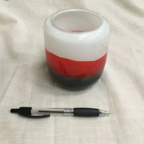Small red, white and green glass vase