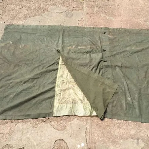 green canvas tarpaulin piece with window and window cover