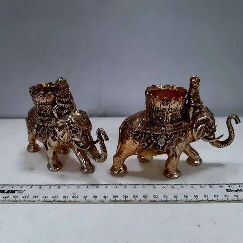 Pair of gold plastic elephant candle holders