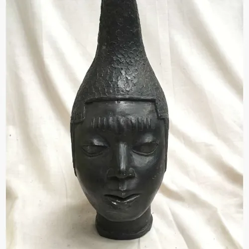 Large African face ornament 
