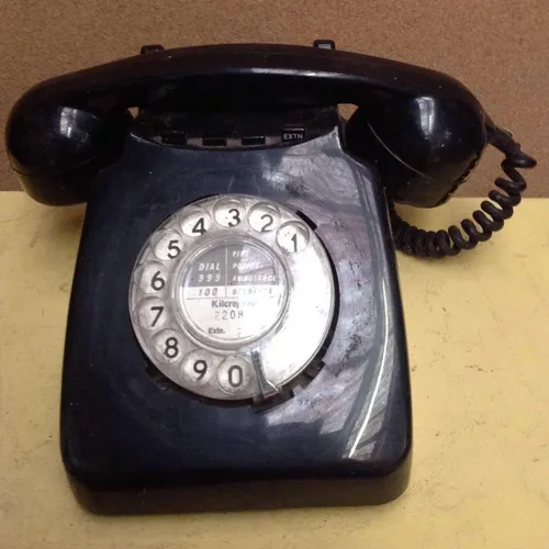 black GPO corded rotary dial telephone