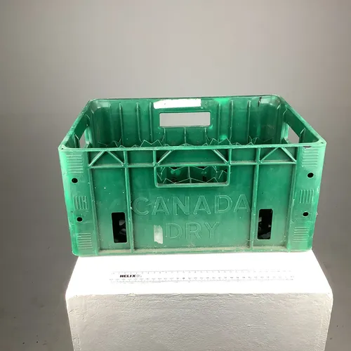 Green plastic bottle crate