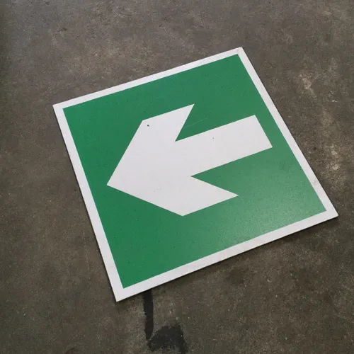 Green and White Arrow Sign