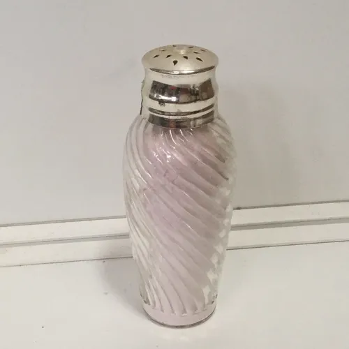 Clear glass powder bottle with silver lid