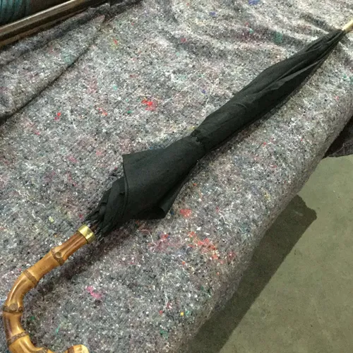 Black umbrella with light wood handle