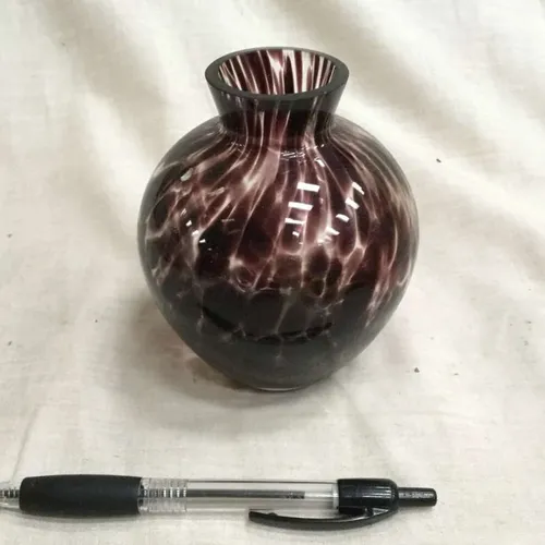 Circular brown glass vase