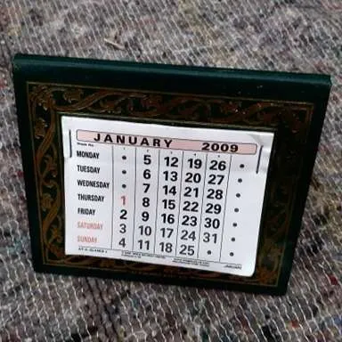 Small green and gold desk calendar 2009