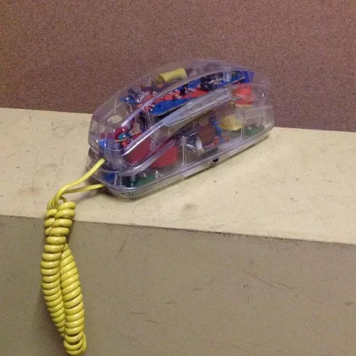 Period Conairphone clear plastic with yellow cable