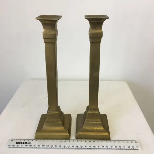 Pair of tall square brass candlesticks