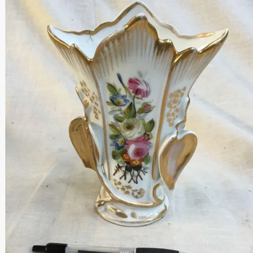 White china vase with gold trim and floral decoration