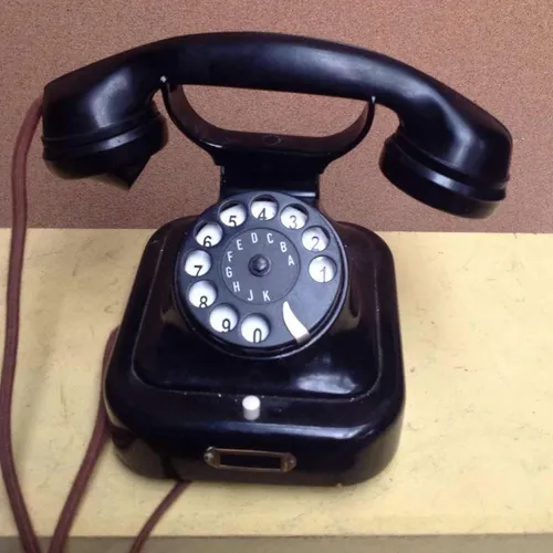 black corded rotary dial with flex cord