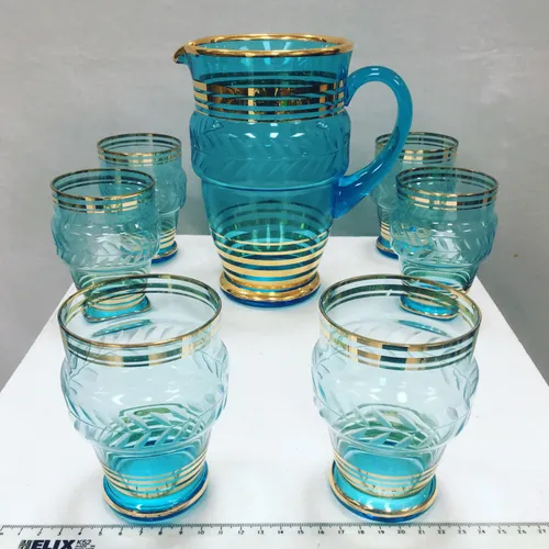 Water jug with 6 blue glass set, gold and etched design