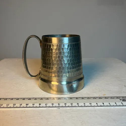 Silver pewter beer mug with hammered detail