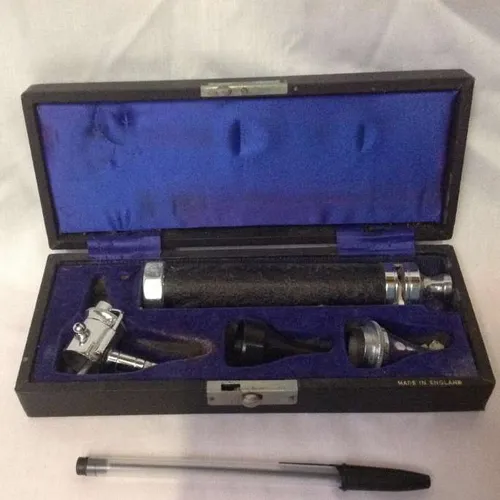 silver and black otoscope with two ear pieces and case