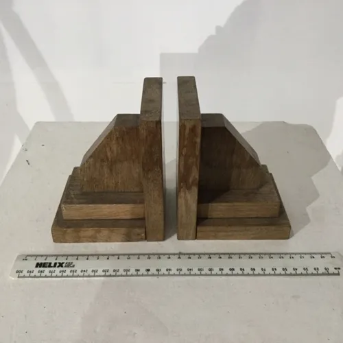 Pair of wooden 'L' shaped bookends with diagonal wooden block book end