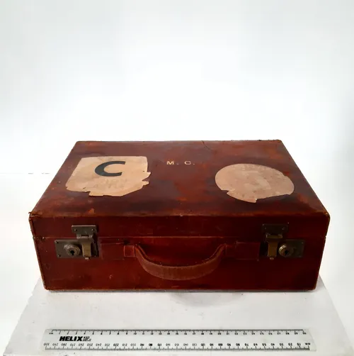 Small red/burgundy case with gold M.C. embossed initials (Finnigan's of Bond Street, London) 