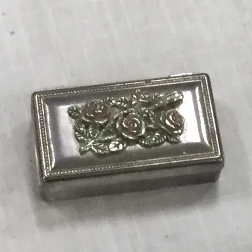 Small silver trinket box with rose design 