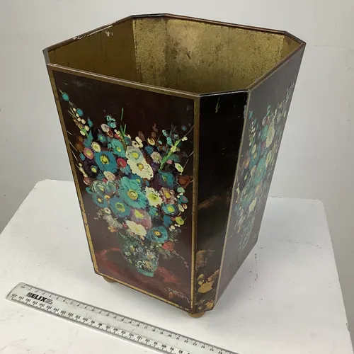 brown metal waste bin with floral design