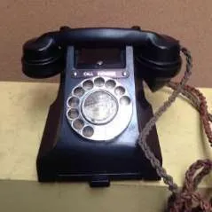 black rotary dial corded telephone with flex cord