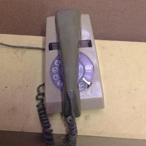 two tone green corded trimphone telephone with rotary dial