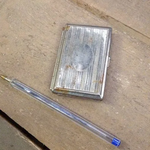 rusty silver cigarette case
