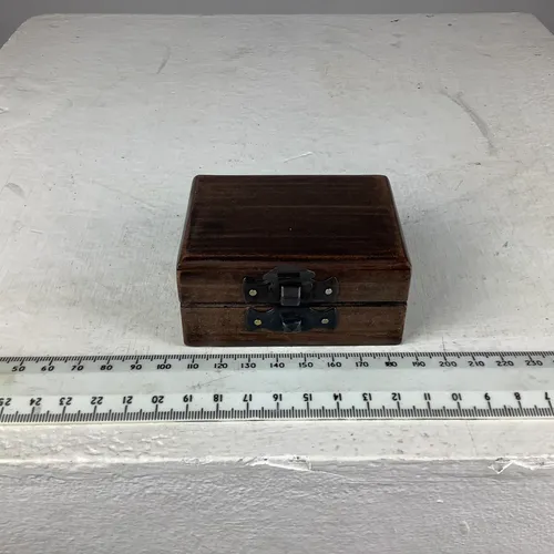 Small dark wood box with black metal clasp