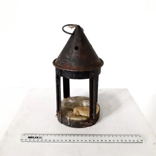 Metal lantern with cone shaped top