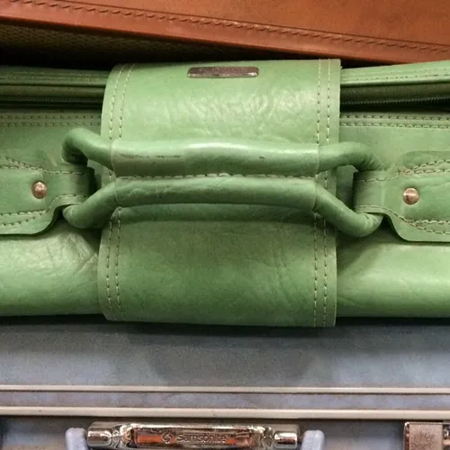 Period green leather Samsonite suitcase