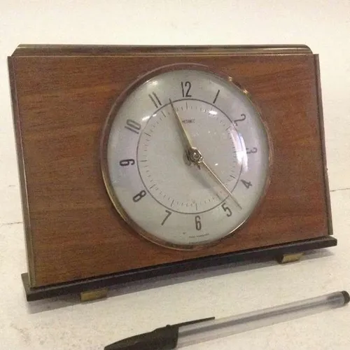 Metamec faux wood mantle clock with silver face and glass face cover