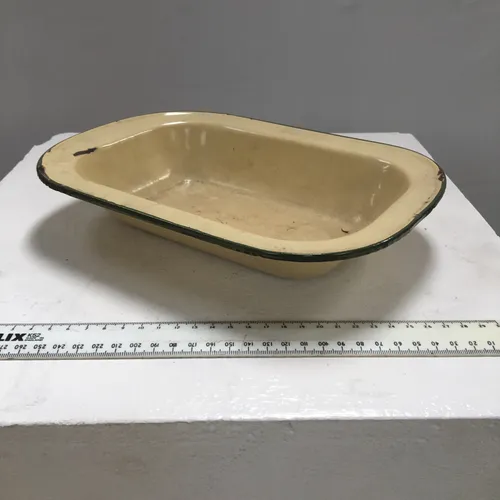 Cream enamel dish with green rim