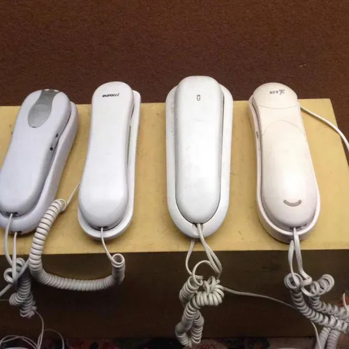 corded white telephones