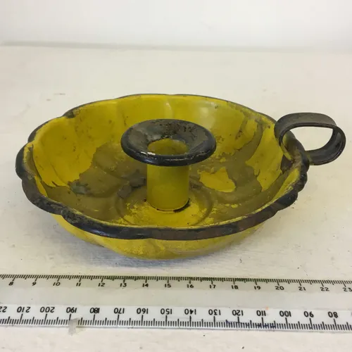 Yellow painted metal chamberstick 