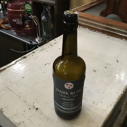 Dark rum brown glass bottle