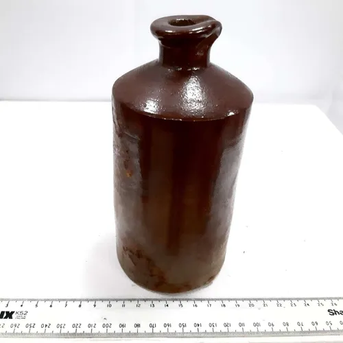 Dark brown stoneware bottle 