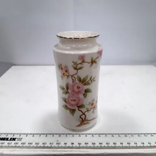 Small china vase with rose design and gold trim