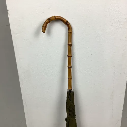 Khaki green umbrella with ridged wood handle