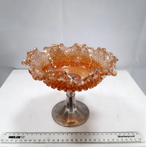 Ornate orange glass dish with silver glass stand 