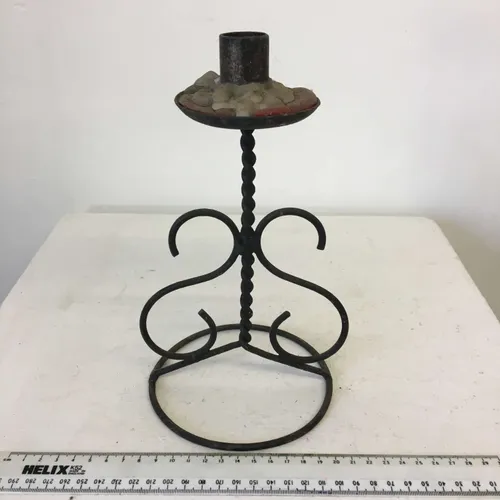 Iron candle holder for pillar candle with twisted S design