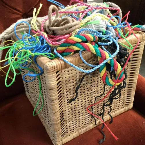 Wicker basket with various pieces of rope