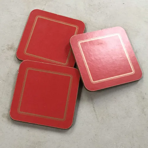Set of three red coasters