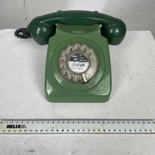Green rotary phone with cable