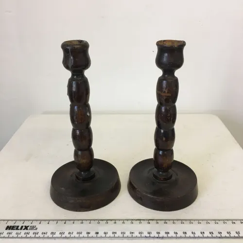 Pair of dark wood candlesticks