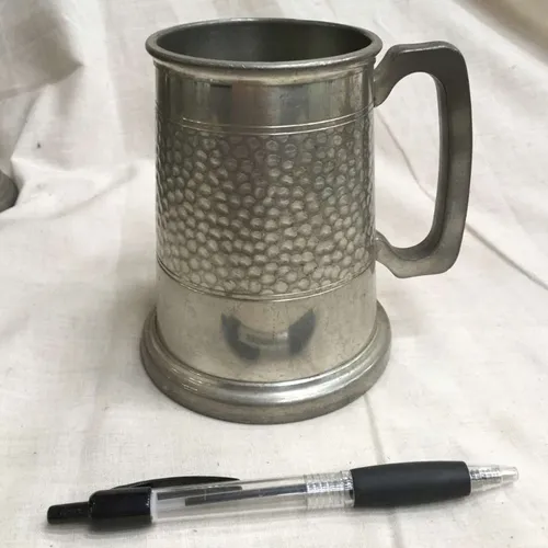 Polished Metal tankard (with Section of speckled indentations)
