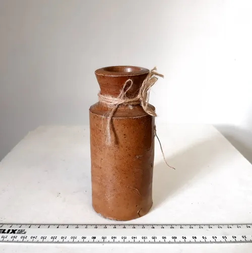 Tan coloured stoneware pots/bottles
